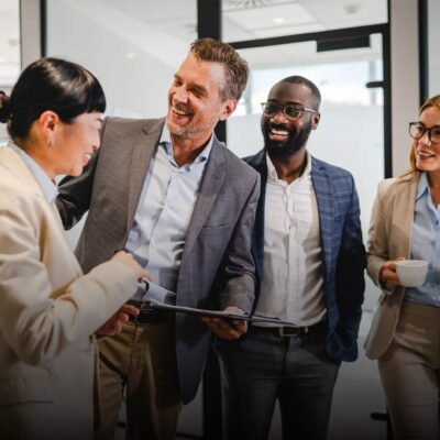 Multicultural businesspeople engaged in a casual office meeting