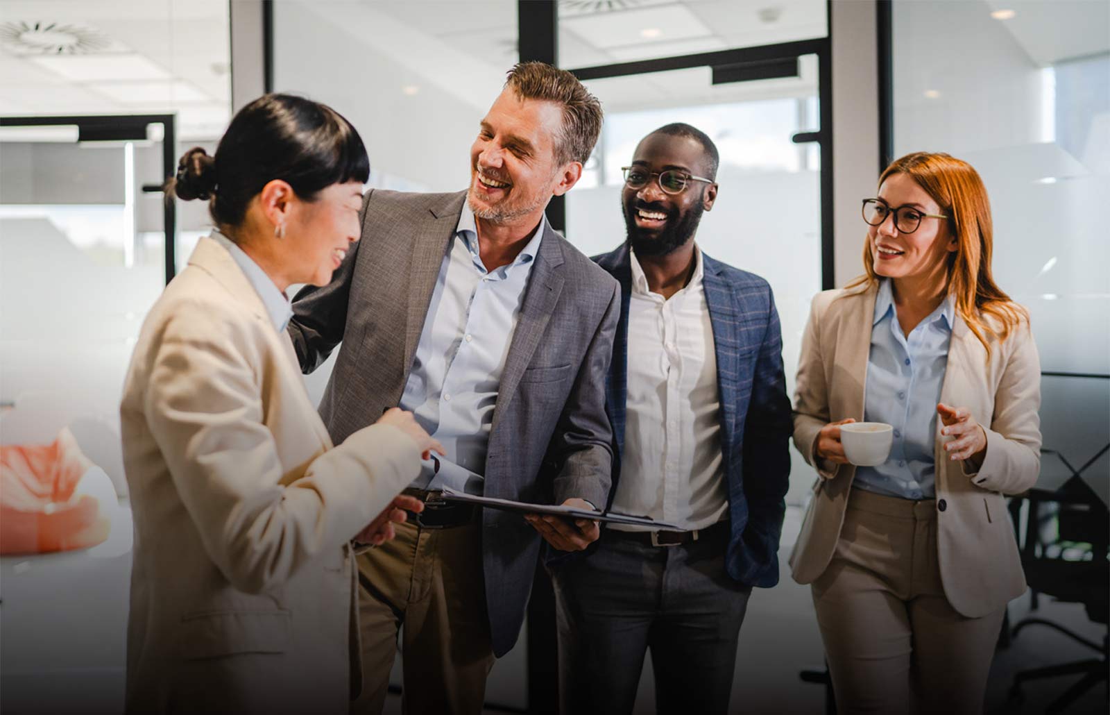 Multicultural businesspeople engaged in a casual office meeting